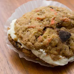 A carrot cake cookie with cream cheese filling