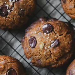Chocolate chip cookies cooling on a wire rack