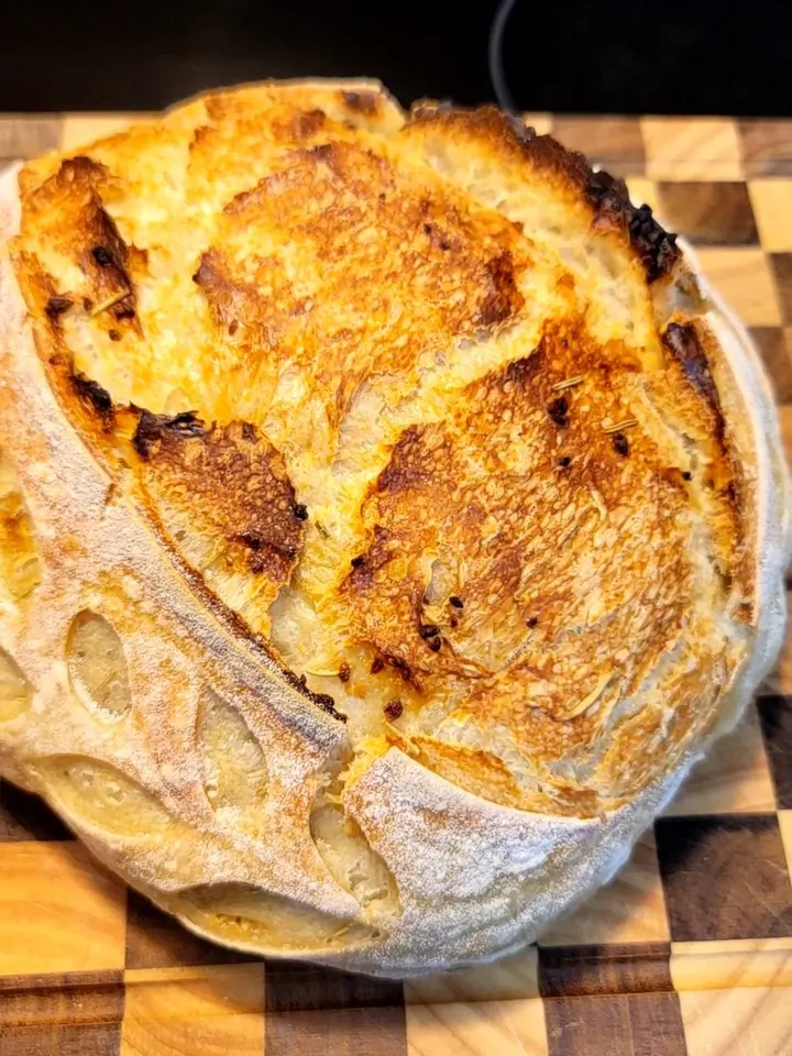 A golden rosemary and garlic sourdough boule